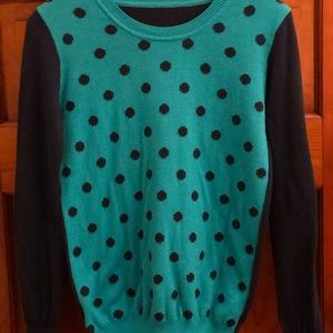 Green sweater with blue polka dots